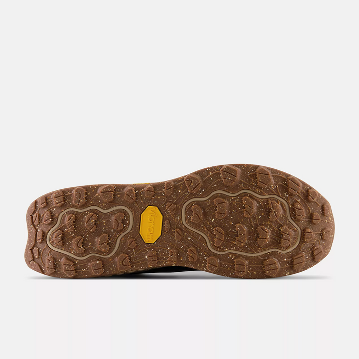 New Balance Foam X Hierro Mid GTX hiking shoes outsole in brown with rugged Vibram traction pattern and speckled detailing.