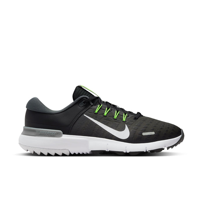 Nike Free Golf Next Nature golf shoes in black with white Nike swoosh, mesh upper, green lace accents, and white sole, side view.