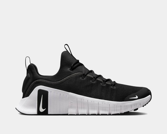 Nike Free Metcon 6 TB training shoes in black with a white midsole, breathable mesh upper, and side-view Swoosh detail.
