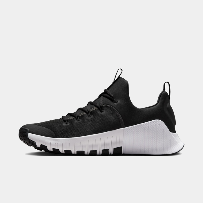 Nike Free Metcon 6 TB training shoes in black with a lightweight mesh upper and white textured midsole, side view.