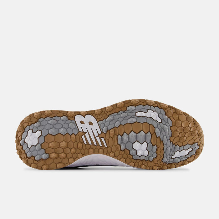 New Balance Golf Fresh Foam Contend v2 golf shoe outsole showing hexagonal grip pattern in tan and gray rubber.