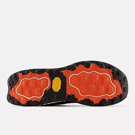 New Balance Fresh Foam Hierro v7 trail running shoes outsole with Vibram grip, black and orange rubber lugs, bottom view.