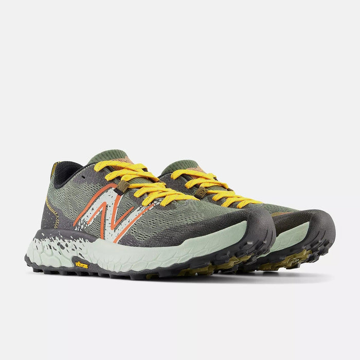 New Balance Fresh Foam Hierro v7 trail running shoes in olive green and gray with yellow laces, Vibram outsole, front angle view.