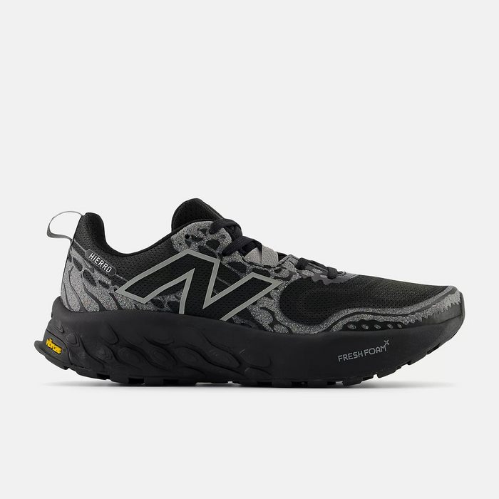 New Balance Fresh Foam Hierro v8 trail running shoes in black and gray with patterned mesh upper, Fresh Foam midsole, and Vibram outsole, side view.