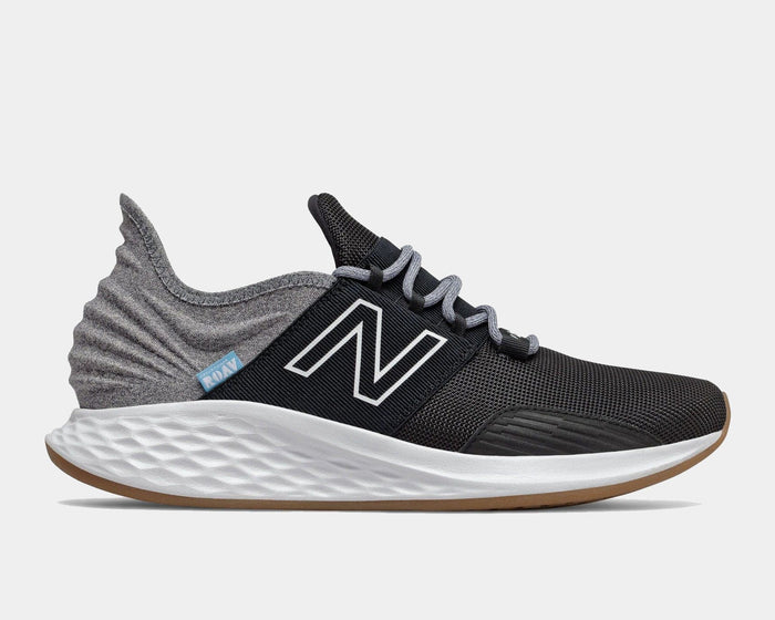 New Balance Fresh Foam Roav Tee Shirt running shoes in black and gray with mesh upper, Fresh Foam midsole, and gum outsole, side view.