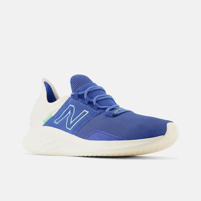 New Balance Fresh Foam Roav running shoes in blue mesh upper with white and neon green accents, side front angle view.