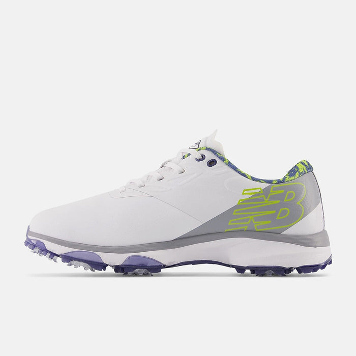 New Balance Golf Fresh Foam X Defender golf shoes side view in white with lime green accents, Fresh Foam cushioning, and purple spiked outsole.