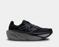 New Balance Fresh Foam X More v5 running shoes in black with a plush midsole and lightweight mesh upper, side view.