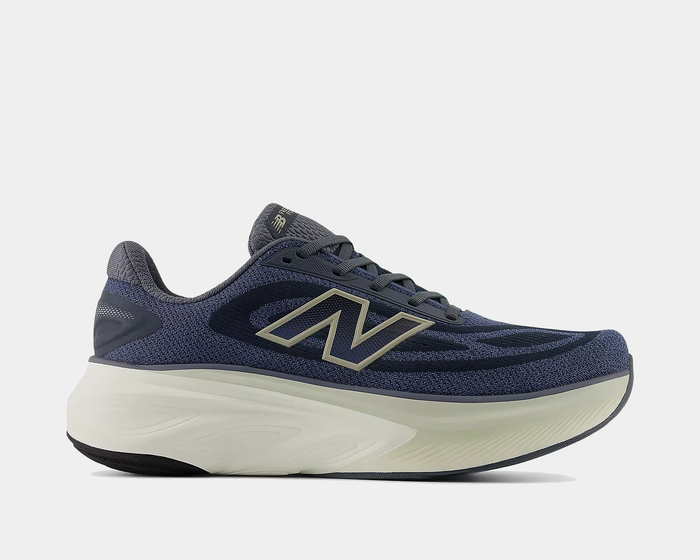 New Balance Fresh Foam X More v6 running shoes in navy blue with breathable mesh upper, cushioned midsole, and durable outsole, side view.