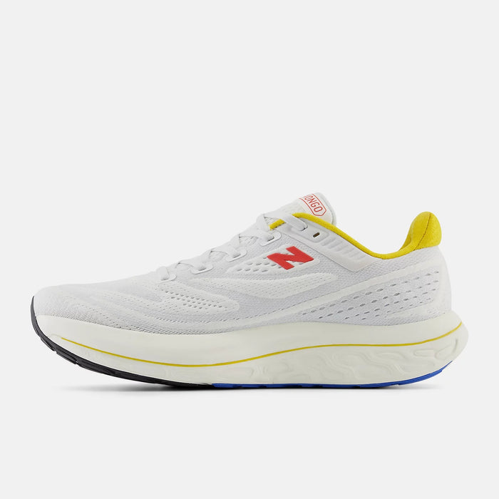 New Balance Fresh Foam X Vongo v6 running shoes in white with yellow accents, breathable mesh upper, and cushioned midsole, side view.