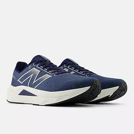 New Balance FuelCell Propel v5 running shoes in navy blue with white accents, featuring lightweight mesh upper and FuelCell cushioning, angled front view.