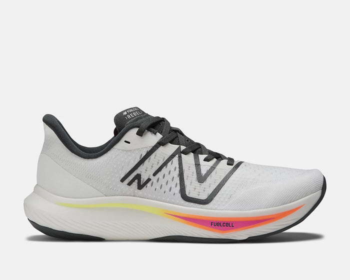 New Balance FuelCell Rebel v3 running shoes in white with black accents, breathable mesh upper, and cushioned midsole with gradient orange and pink details, side view.