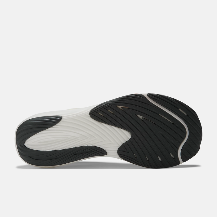 New Balance FuelCell Rebel v3 running shoes outsole with black rubber tread and white midsole, sole/bottom view.