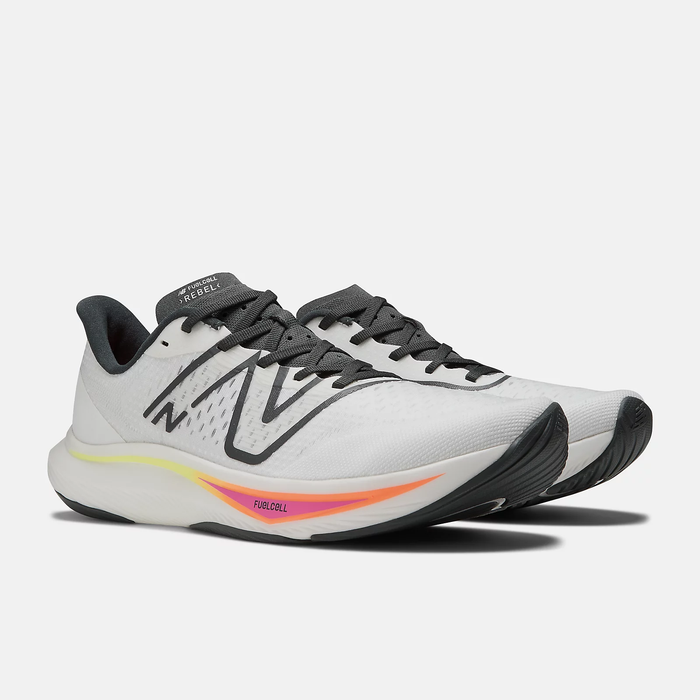 New Balance FuelCell Rebel v3 running shoes in white with black detailing, FuelCell midsole, and gradient accents, angled side view.