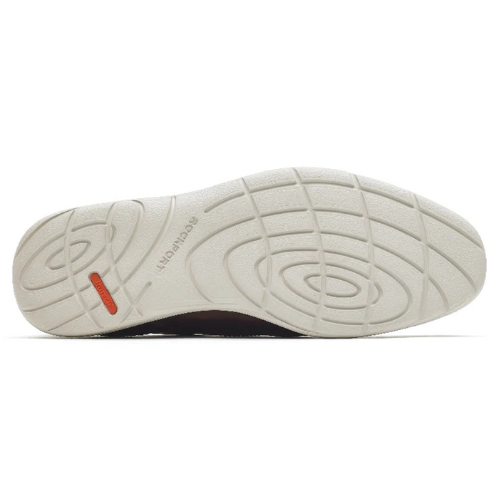 Rockport Garett Plain Toe outsole in white rubber with textured grip patterns and branded detailing, sole/bottom view.