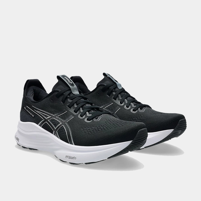 Asics Gel-Kayano 32 running shoes in black with breathable mesh upper and white midsole, front angle view showing dual shoes.