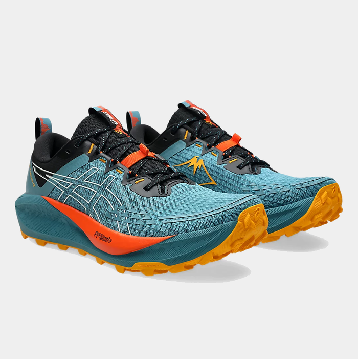 Asics Gel Trabuco 13 trail running shoes in blue with orange accents, mesh upper, rugged outsole, and lace system, front side view.