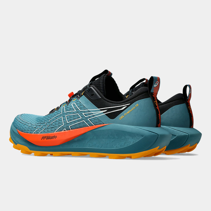 Asics Gel Trabuco 13 trail running shoes in teal, black, and orange with FF Blast+ cushioning and durable outsole, side view.