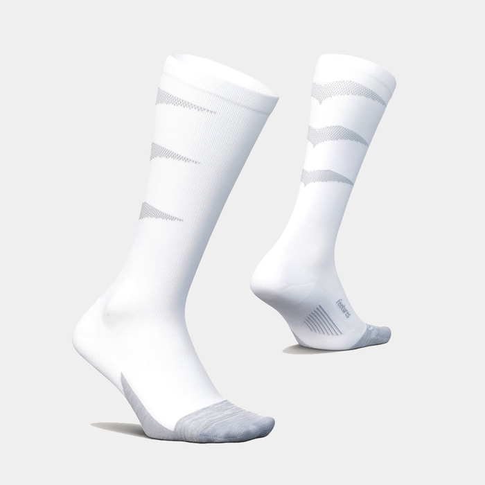 Feetures Graduated Compression Light Cushion Socks in white with gray accents, knee-high design and lightweight cushioning, side angle view.