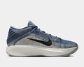 Nike G.T. Hustle 3 basketball shoes in blue and gray gradient mesh upper with black swoosh and cushioned white midsole, side view.