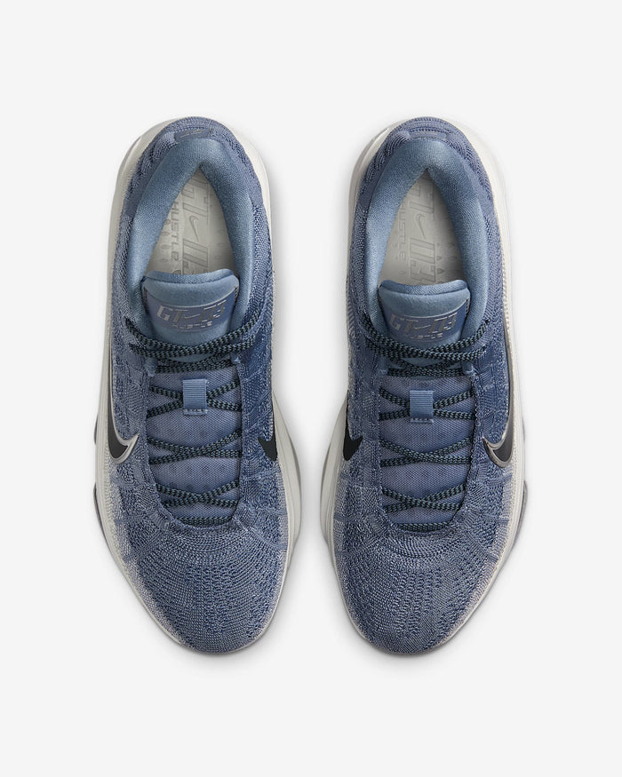 Nike G.T. Hustle 3 basketball shoes top view in blue with textured mesh upper, black accents, and cushioned inner lining