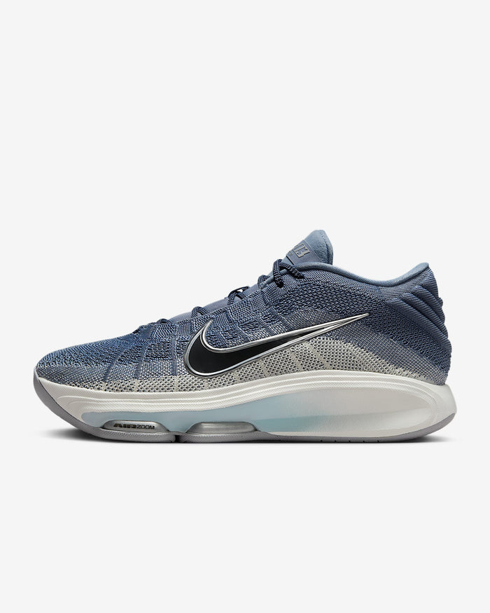 Nike G.T. Hustle 3 basketball shoes in blue and gray mesh with Air Zoom cushioning and black Nike swoosh, side view.