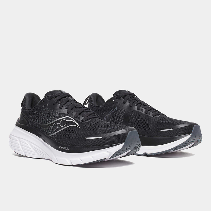 Saucony Guide 18 running shoes in black with mesh upper and white PWRRUN cushioning midsole, angled front view.