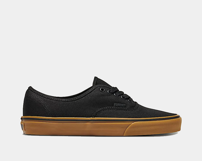Vans Gum Authentic sneakers in black canvas with a gum rubber sole and lace-up design, side view.