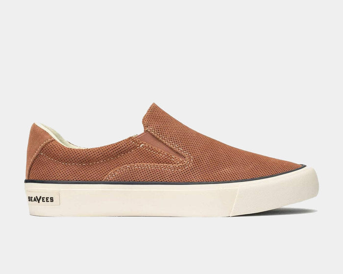 SeaVees Hawthorne Slip On shoes in light brown perforated suede with white rubber sole, side view.