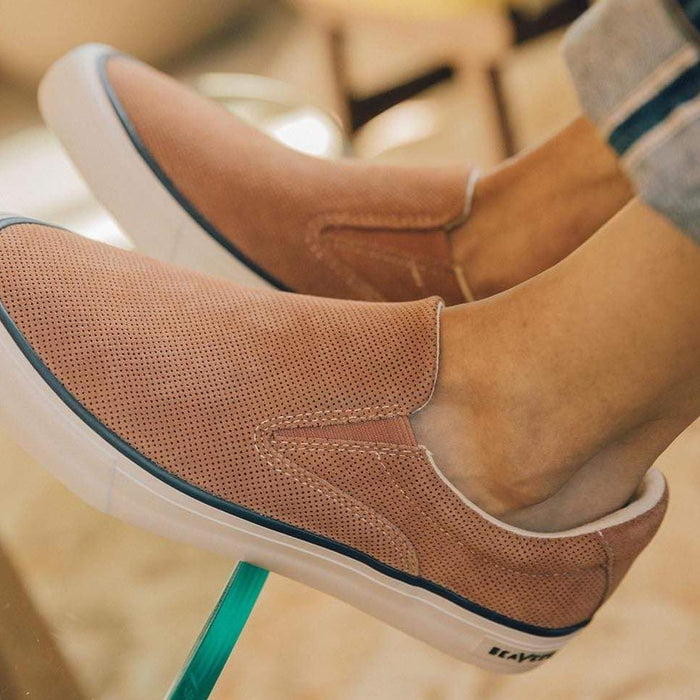 SeaVees Hawthorne Slip On shoes in textured tan suede with white rubber soles and elastic gore panels, worn casually indoors.