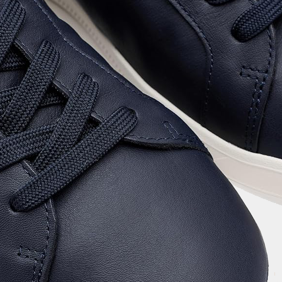 Polo Ralph Lauren Heritage Court II Leather sneakers, close-up view showing navy blue leather upper and laces.