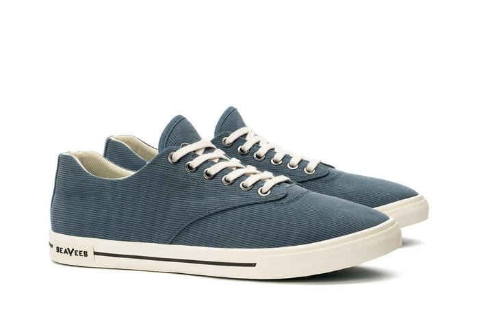 SeaVees Hermosa sneakers in blue textured canvas with white rubber soles and off-white laces, side-angle view.