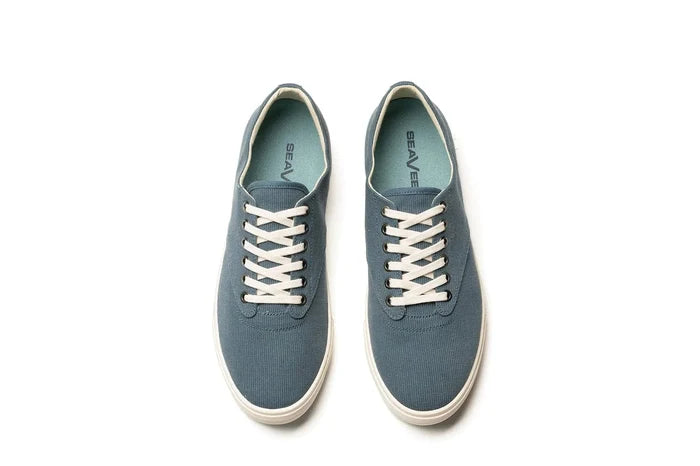 SeaVees Hermosa sneakers in blue canvas with white laces and a matching rubber sole, top view showing inner logo and lace design.