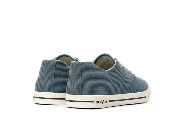 SeaVees Hermosa sneakers in blue textured material with off-white midsoles and black stripe detail, back and side view.