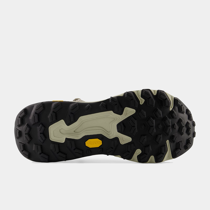 New Balance Hierro Hiker hiking shoes outsole with Vibram Megagrip rubber in black and beige, bottom view.