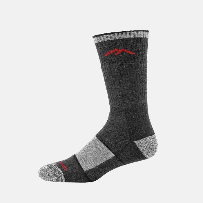 Darn Tough Hiker Boot Midweight Hiking Sock in charcoal gray with red mountain logo and reinforced heel and toe, side view.