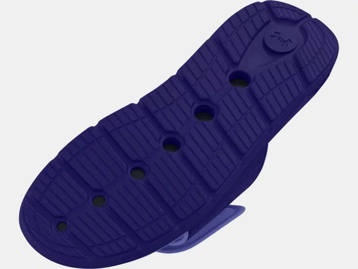 Under Armour Ignite 7 SL sandal outsole in solid purple with textured grip and flex grooves, sole/bottom view.