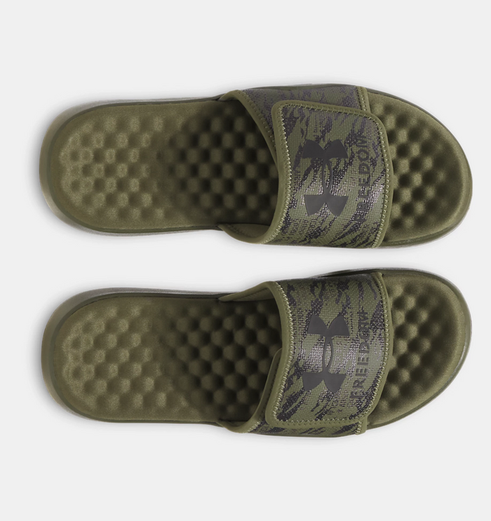 Under Armour Ignite Pro 8 Freedom Slides in olive green with camo-style strap and textured cushioned footbed, top view.