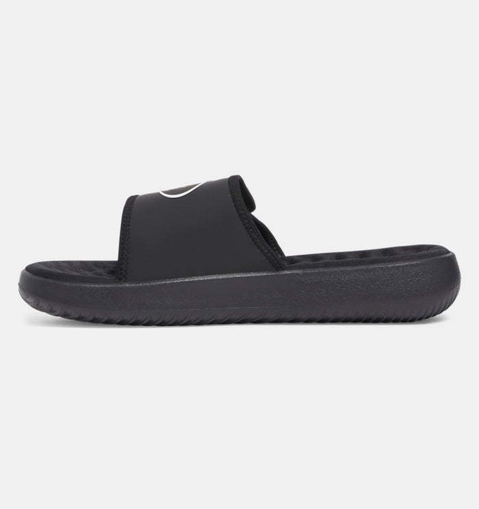 Under Armour Ignite Pro 8 slides in black with cushioned footbed and textured outsole, side view.