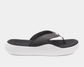 Under Armour Ignite Pro 8 T sandals with black synthetic straps, cushioned black textured footbed, and white foam outsole, side view.