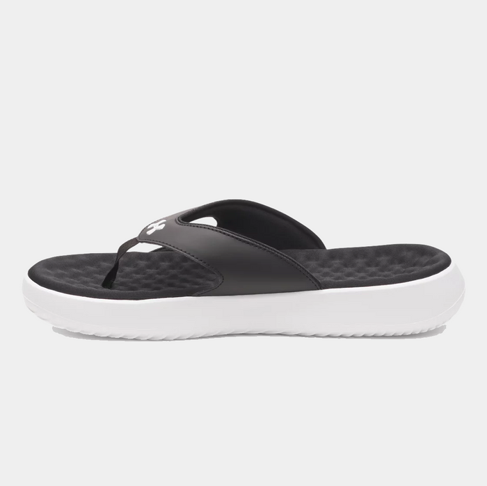 Under Armour Ignite Pro 8 T sandals in black with textured foam footbed and white sole, side view.