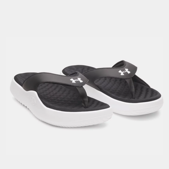 Under Armour Ignite Pro 8 T flip-flops in black with cushioned footbed and white outsole, angled front view.