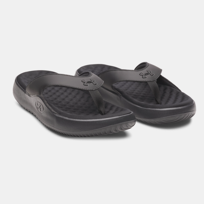 Under Armour Ignite Pro 8 T sandals in black with padded footbeds and textured straps, angled front side view.