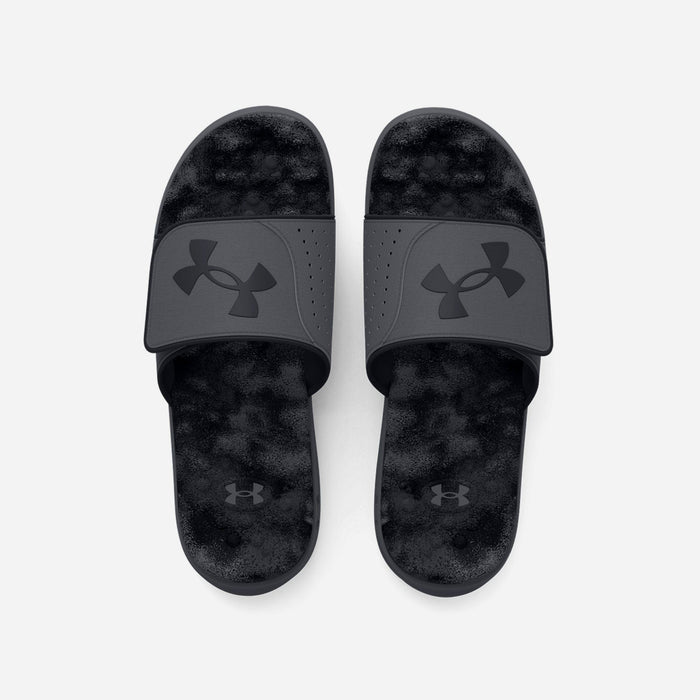 Under Armour Ignite Pro Graphic Strap Slides in black with textured footbed and adjustable strap, top view.