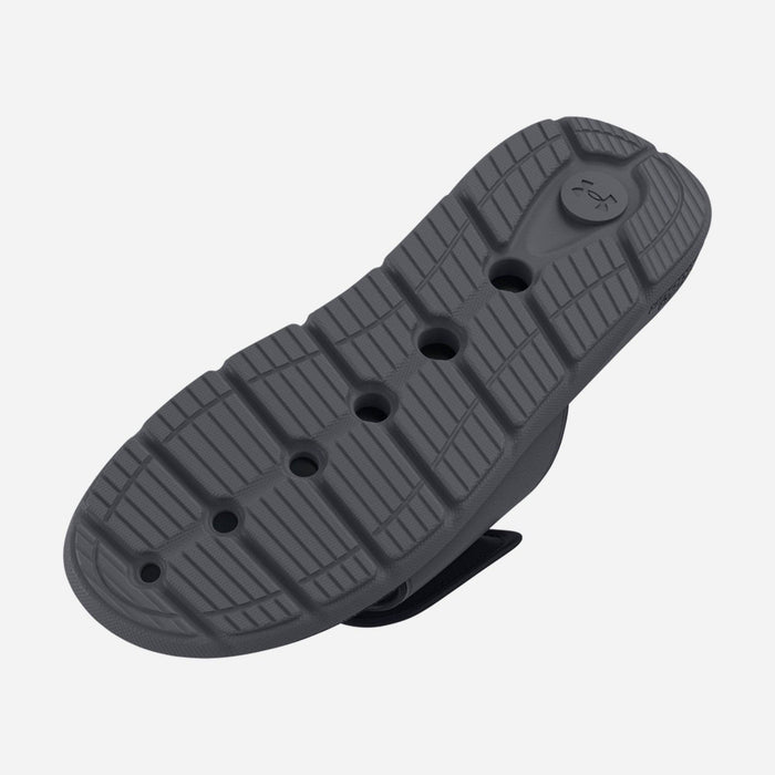 Under Armour Ignite Pro Graphic Strap Slides outsole showcasing textured tread design and flex grooves in dark gray rubber.