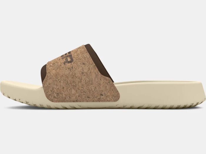 Under Armour Ignite Select Cork Slides with a natural cork strap and cushioned beige sole, side view.