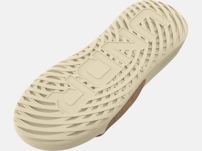 Under Armour Ignite Select Cork Slides outsole in beige showing textured grip pattern and cork footbed detail.