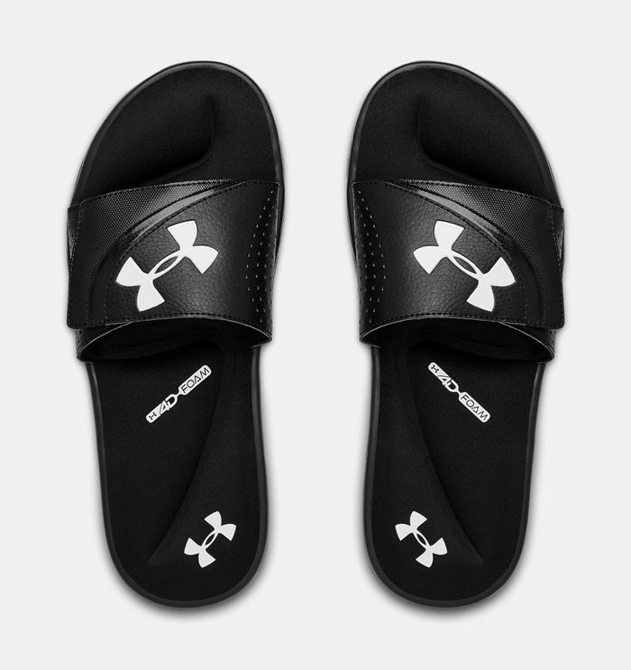 Under Armour Ignite VI SL sandals in black with white logo on strap and footbed, featuring cushioned foam sole, top view.