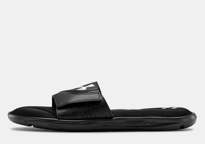 Under Armour Ignite VI SL black slide sandals with adjustable strap and cushioned footbed, side view.