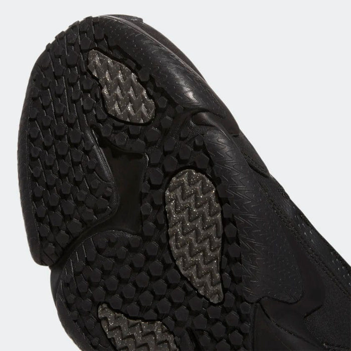 Adidas Impact FLX outsole in black with textured tread pattern for enhanced grip and durability, close-up bottom view.